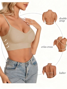 Detail view of seamless beige bra showing double strap criss-cross and halter styles