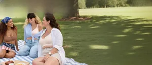 Three models wearing seamless wireless bras in outdoor picnic scene with natural lighting