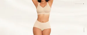 Detail view of seamless beige wireless bra and high-waisted briefs on a model