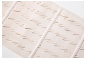 Detail view of skin-tone waist trainer featuring breathable mesh and vertical support bones