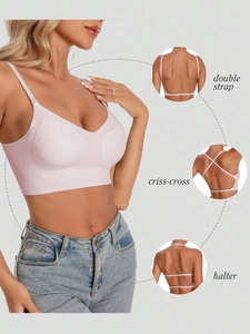 Detail of a seamless pink sports bra showing double strap, criss-cross, and halter styles