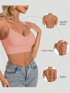 Detail showing versatile multi-way straps including halter and criss-cross styles on pink bra