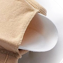 Detail of padded bralette showing knit fabric texture and removable white foam cup