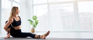 Detail of black yoga set with stylish cross-strap design on the high-stretch leggings