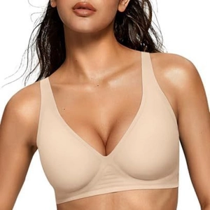 Close-up of beige seamless wireless V-neck bra with wide shoulder straps on a model