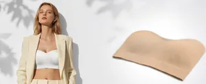 Detail of strapless bandeau bra in white and beige showing supportive seamless texture