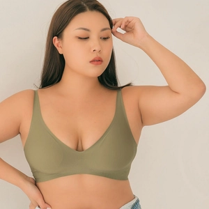 Detail view of seamless V-neck wireless bra in olive green showing smooth texture