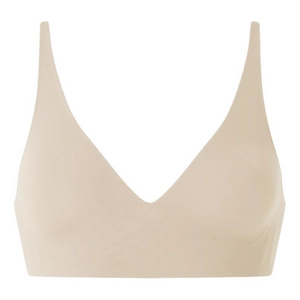 Detail of a beige seamless V-neck bra with thin straps and smooth fabric texture
