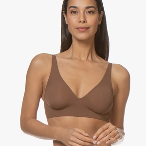 Close-up of brown seamless V-neck wireless bra with soft stretch fabric on model