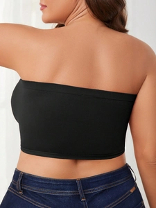 Close-up of black seamless strapless bandeau top showing high-elastic fabric and anti-slip edge