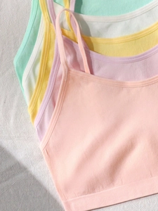 Close-up of ribbed seamless cotton camisoles for teen girls in various macaron colors