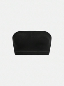 Detail of black seamless strapless bandeau bra with wide elastic anti-slip bottom band