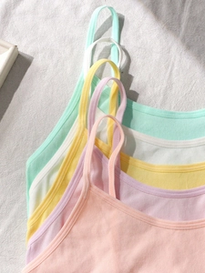 Detail showing five pastel seamless ribbed cotton camisoles for teen girls