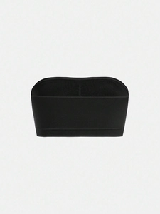 Detailed view of black strapless bandeau tube top featuring elastic ribbed fabric texture