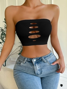 Detail of black ribbed seamless tube top featuring horizontal oval hollow out design