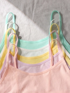 Macro detail of seamless ribbed fabric texture on colorful girls camisole bras