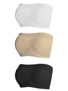 Three-pack set of seamless strapless tube bras in black, white, and beige with ribbed edges