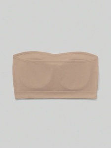Close-up of seamless nude tube top for girls with wide elastic band and removable pads