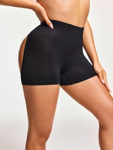 Detailed view of high waist butt lifting shapewear with seamless black compression fabric