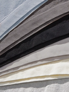 Detailed macro view of seamless knitted fabric with breathable honeycomb texture in multiple colors