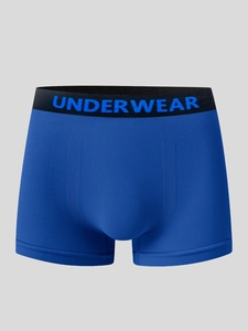 Detail of navy blue men boxer briefs with elastic lettered waistband and U-convex design