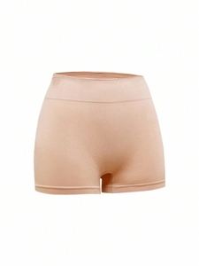 Detailed macro view of the seamless high-waist tummy control shaping fabric with V-textures