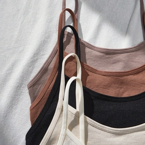 Teen girls seamless ribbed camisole bras in neutral tones with natural sunlight shadows