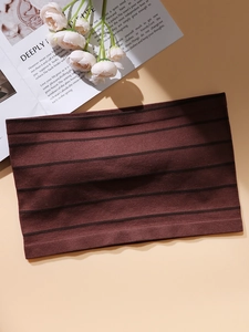 Close-up of brown striped strapless bandeau bra in premium ribbed knitted fabric