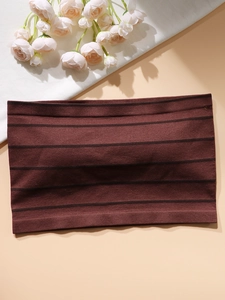 Detailed close-up of dark brown seamless ribbed tube top bra showing fine fabric texture