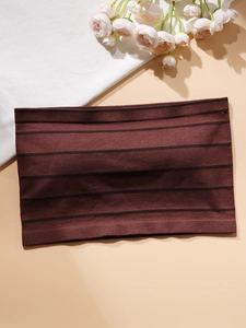 Detail of brown striped tube top featuring elastic ribbed edges and high-quality knit texture