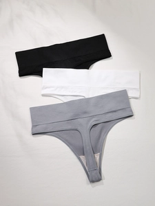 Three-pack of seamless high-waist thongs in black, white, and grey with elastic waistbands