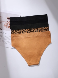Detailed flat lay of leopard print, black and yellow seamless high-elasticity panties