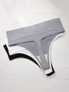 Three-pack seamless cotton thong set for women in grey, white, and black colors