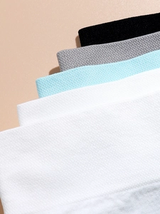 Close-up of honeycomb breathable texture on seamless panties in black, grey, blue and white
