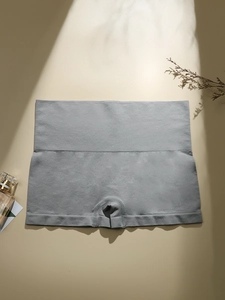 Detail of gray seamless high-waisted safety shorts featuring honeycomb elastic waistband