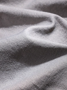 Macro shot of grey seamless glitter fabric with breathable honeycomb knit texture