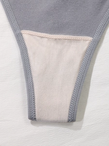Close-up of seamless gray thong showing premium cotton crotch and reinforced stitching