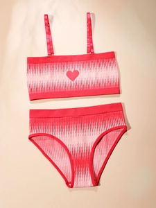 Close-up of red seamless lingerie set with pink pixelated textures and heart detail