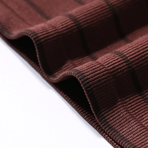 Seamless strapless tube top in brick red ribbed fabric with detailed vertical stripes