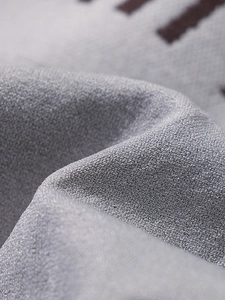 Close-up of grey breathable mesh fabric with premium texture and micro-grid weave