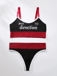 Detail view of seamless two-piece sports bra and thong set with racing checkerboard print