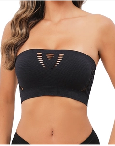 Close-up of black seamless bandeau top with V-shaped laser cutouts and knit fabric texture