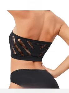 Detail of black seamless tube top featuring laser-cut hollow-out back design