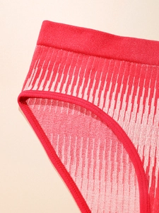 Detail of red seamless knitted briefs with gradient jacquard and ribbed elastic waistband