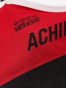Detail of red and black seamless sports bra with Come Along Modern printed text