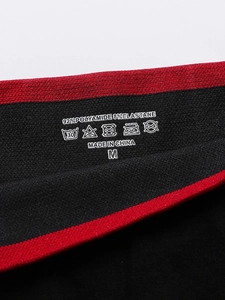 Detail of printed fabric tag showing 92% Polyamide material and size M on sports bra
