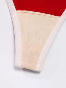 Macro view of double-layer cotton gusset detail on red sports underwear for women