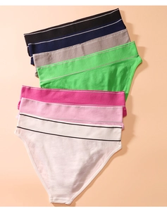Detail view of seven seamless cotton underwear pieces in diverse colors with LOVE waistbands