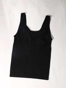 Detail of black slimming bodysuit with wide straps and built-in bra padding