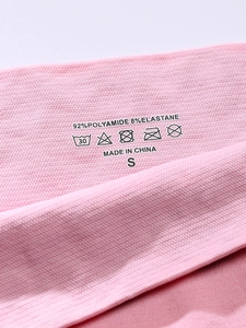 Detail of pink heart panty showing 92% Polyamide fabric blend and size S label